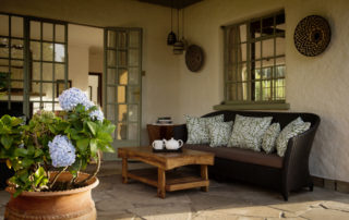 Sabyinyo Silverback Lodge - Guest cottage verandah seating area